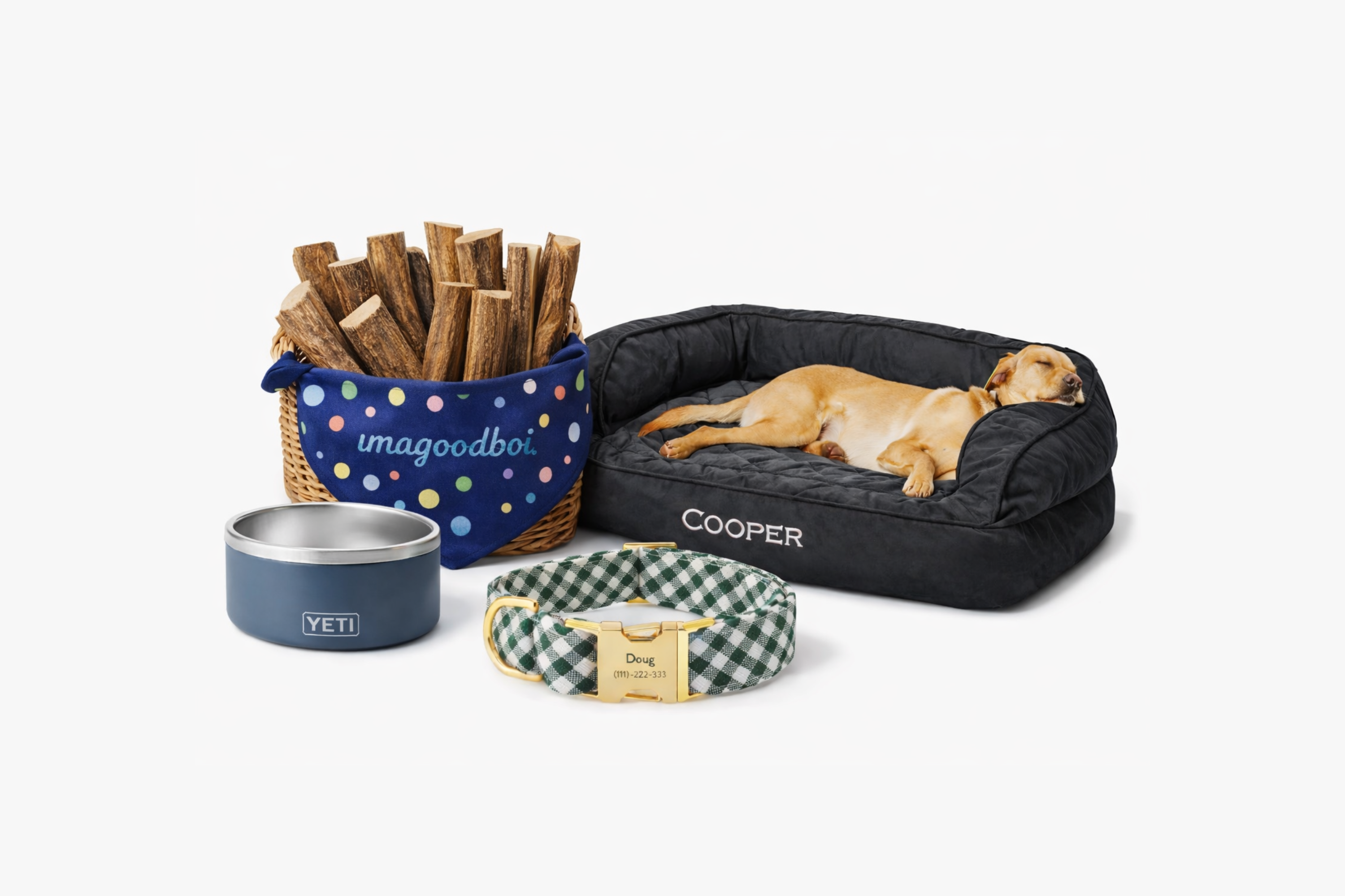Dog bed, treats, water bowl, and collar with 'Cooper' on a white background